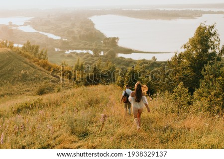 man and woman are walking in a very beautiful place, summer landscape and people