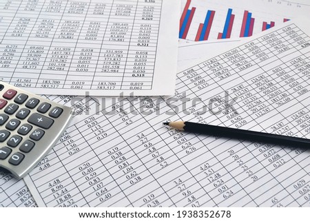 Photos of charts, diagrams and numbers showing the rise and fall in the market