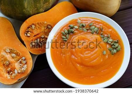 Close up photo of pureed pumpkin soup with pumpkin seeds
