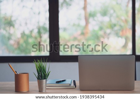 Workplace with laptop computer and office supplies with the relaxing atmosphere