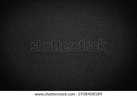 Beautiful textured sand black background. Blank for design.