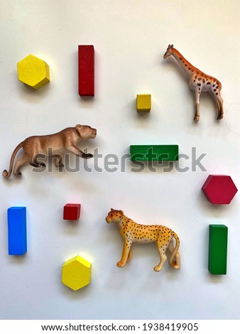 Wooden colored toys for child development. The subject of this photo is wooden toy or plastic toy what should we choose for child development and environmental protection.