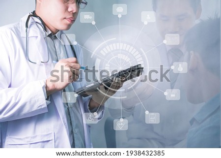 Medical and stethoscope looking at icons and touching icons medical network connection with modern virtual tablet screen interface medical technology network concept 2021