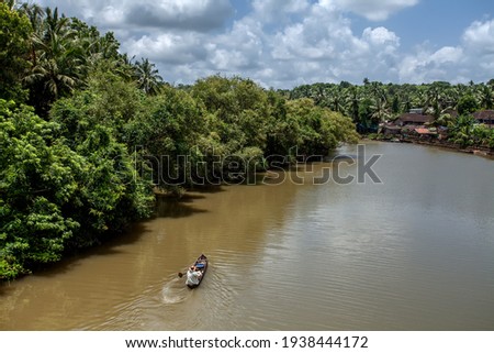 old goa india - old goa along mandovi river fishing boat