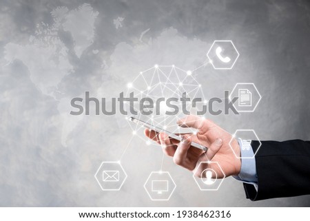 Business concept Close up of man using mobile smart phone and infographic icon of community technology digital.Concept of hi tech and big data. Toned image.