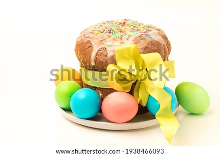Orthodox baking for the Easter Spring Festival. Traditional cakes and painted eggs. Baking sprinkled with icing,