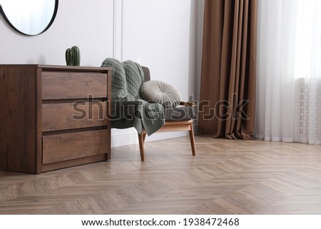 Modern living room with parquet flooring and stylish furniture Royalty-Free Stock Photo #1938472468