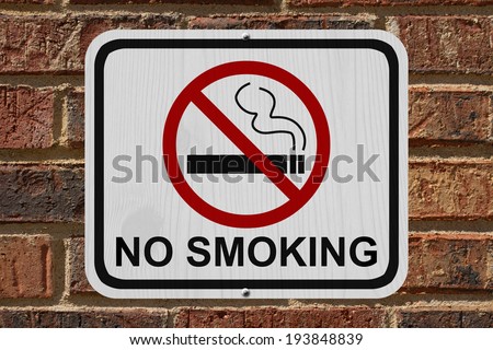 No Smoking Sign, An red and white sign with cigarette icon and not symbol with text No Smoking on a brick wall