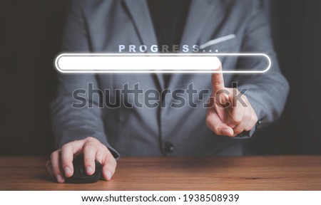 Businessman touching to virtual download bar with loading progressive business. Royalty-Free Stock Photo #1938508939
