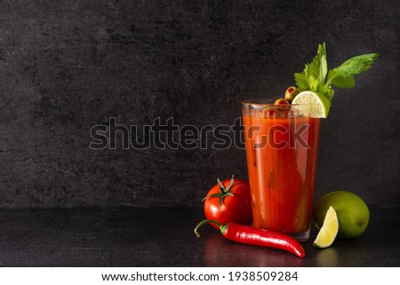 Bloody Mary cocktail in glass on black background.Copy space Royalty-Free Stock Photo #1938509284