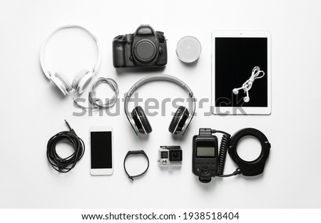 Different modern devices on white background Royalty-Free Stock Photo #1938518404