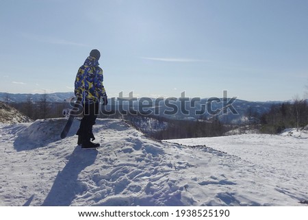 Go snowboarding in the mountains in the Russian Far East                               