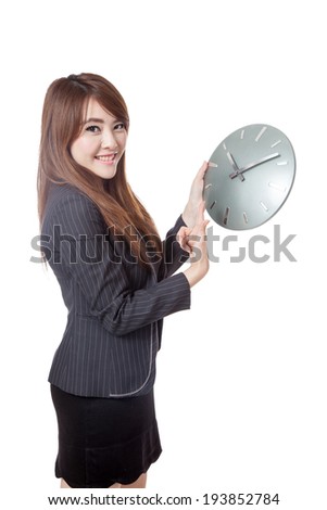 Asian Businesswoman point to a clock and smile  isolated on white background