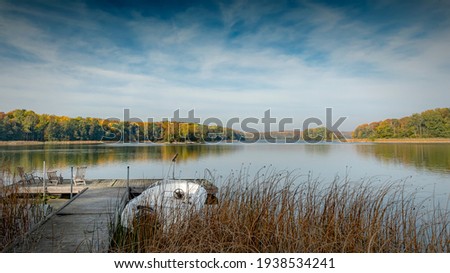 A panoramic image of a swedish lake in autumn.