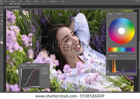 Professional photo editor application. Image of young woman lying in lavender field