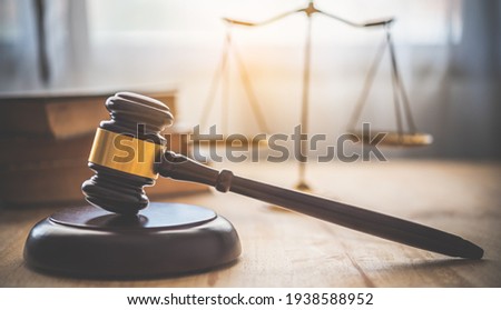 Law theme, mallet of the judge, law enforcement officers, evidence-based cases and documents taken into account.	 Royalty-Free Stock Photo #1938588952