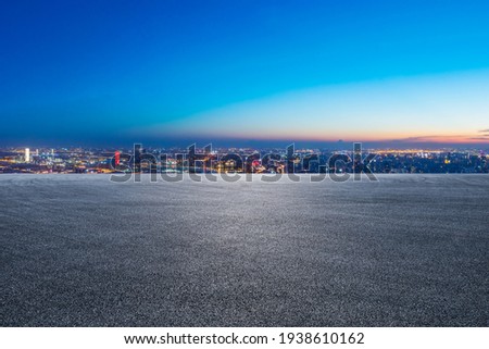 Race track road and city skyline with buildings at night in Shanghai,China.