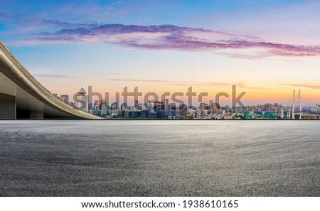 Race track road and city skyline with buildings at sunset in Shanghai,China.