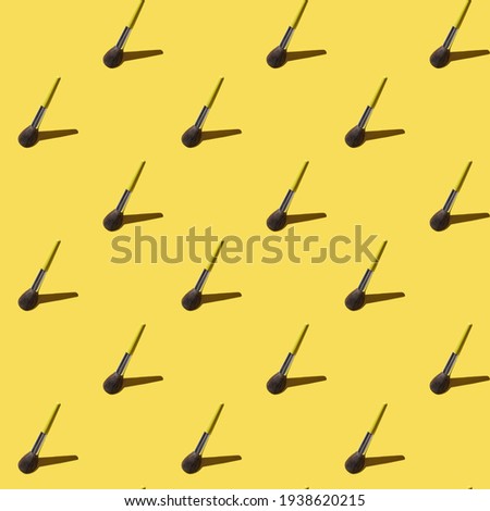 Beauty seamless pattern with brush for make up on trendy yellow background