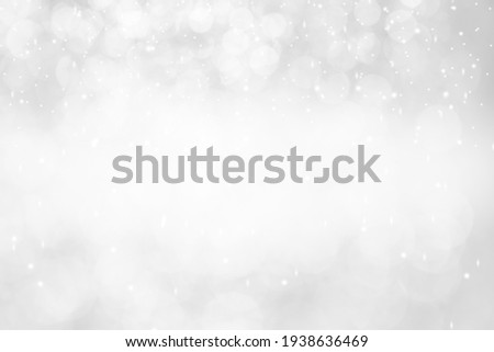 White,Silver glitter vintage lights background defocused for festivals and celebrations. Royalty-Free Stock Photo #1938636469