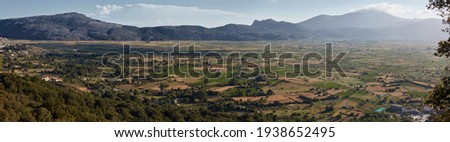 Panorama of fields with beautiful clouds on Lassithi plateau Crete Greece