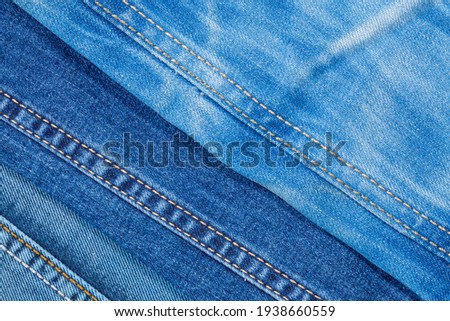 Photo of denim pants from above. Background on the theme of denim clothing.