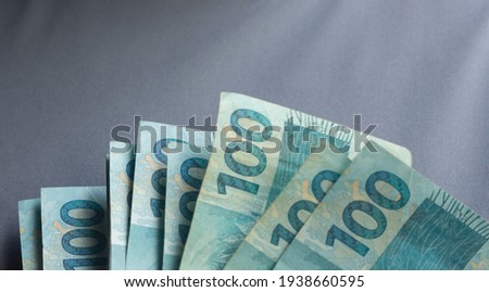 Brazilian money on a gray basis Royalty-Free Stock Photo #1938660595