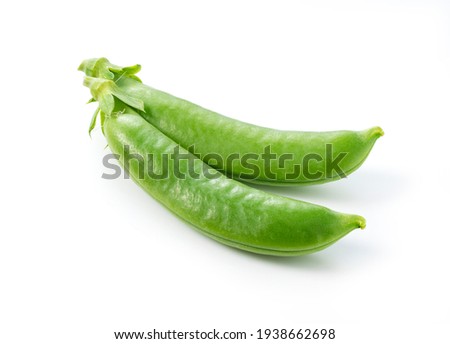 Two snap peas on a white background. Royalty-Free Stock Photo #1938662698