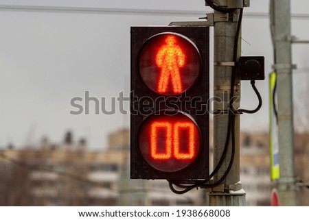 Saint-Petersburg, Russia - March 18, 2021: City traffic light at a pedestrian crossing. Red signal "Stop".