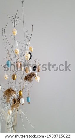 Easter decoration in the form of a tree with eggs and a blank space. High quality photo
