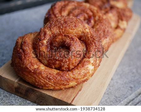Brown baked cinnamon rolls (Dutch Zeeuwse Bolussen) Royalty-Free Stock Photo #1938734128