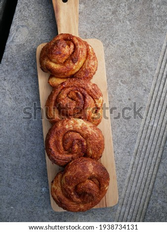 Brown baked cinnamon rolls (Dutch Zeeuwse Bolussen) Royalty-Free Stock Photo #1938734131