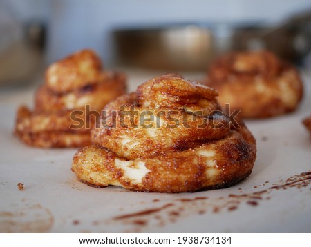 Brown baked cinnamon rolls (Dutch Zeeuwse Bolussen) Royalty-Free Stock Photo #1938734134