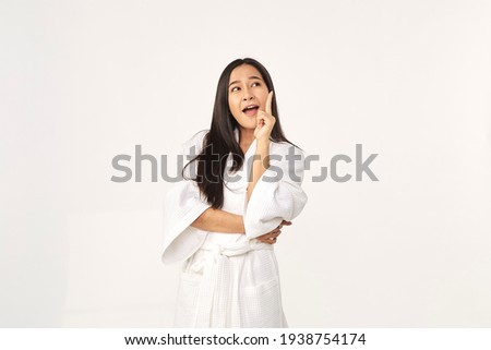Beautiful Asian woman wearing bathrobe smile with clean and fresh skin Happiness and cheerful with positive emotional on white background, Beauty Cosmetics and spa Treatment Concept