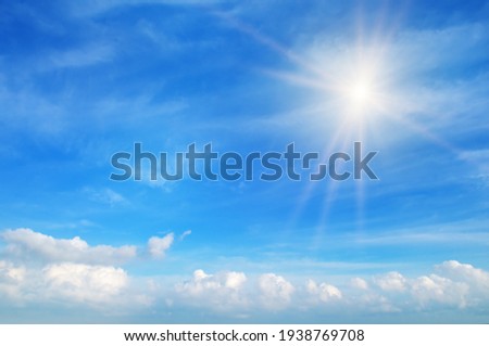 Beautiful, blue summer sky with fluffy clouds and bright sun as a background Royalty-Free Stock Photo #1938769708
