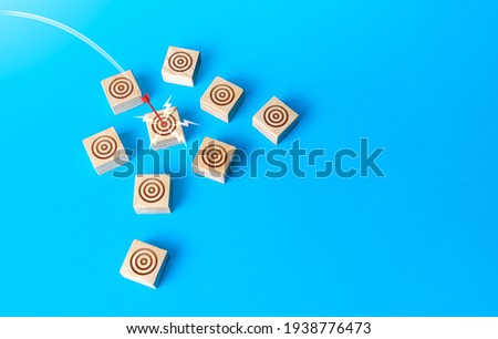 Red bow arrow hits a target circle. Direct shot, Bulls-eye. Marketing, successful targeting, high advertising efficiency in a target audience. Accuracy, budget savings on promotion. Market research. Royalty-Free Stock Photo #1938776473