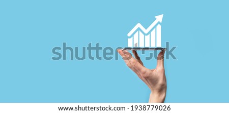 Male hand holding smart mobile phone with graph icon.checking analyzing sales data growth graph chart and stock market on global networking. Business strategy, planning and digital marketing.