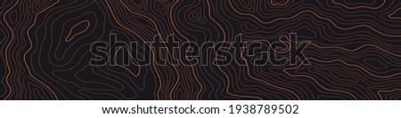 a narrow topographic map on a dark brown background Royalty-Free Stock Photo #1938789502