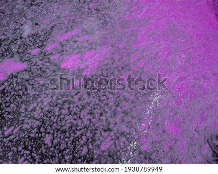 Colorful magenta bath foam with bubbles on the ground. Effect of space and galaxy. Beauty and luxury backdrop. Abstract art. Beautiful pink soap background with waves and foam. Washing suds texture