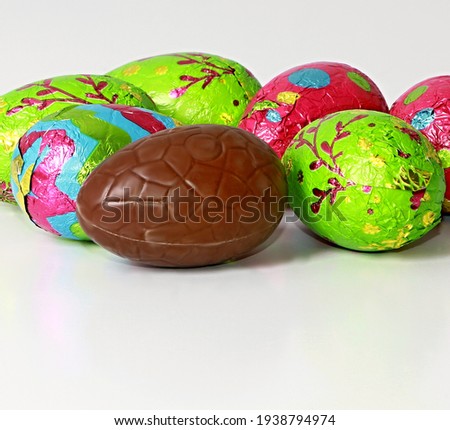 chocolate Easter eggs displayed in many colours stock photo