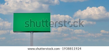 green advertising panel with sky and clouds background. Advertising panel. billboard for mockup