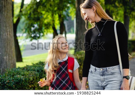 preschool girl walk with her mother