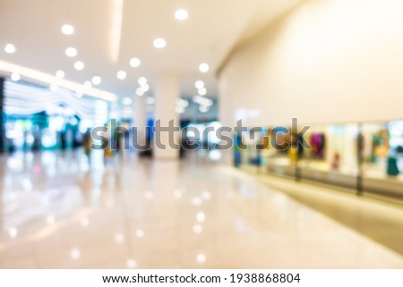Abstract blur and defocused shopping mall retail in department store interior for background