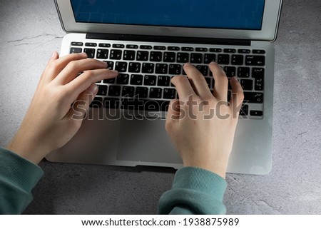 typing on laptop at work  