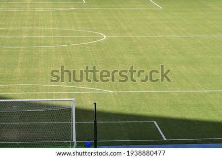 Green football field with nobody