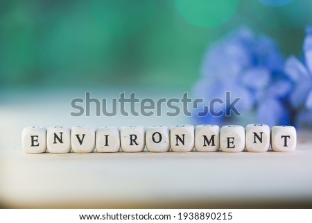Words concept, ENVIRONMENT word cube on bokeh blur background ,English language learning concept.