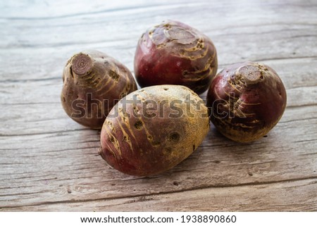 Red beet on the wooden floor Organic beetroot