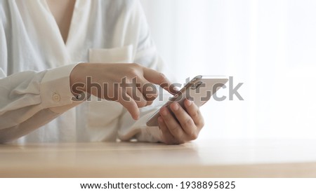asian woman using cell phones
