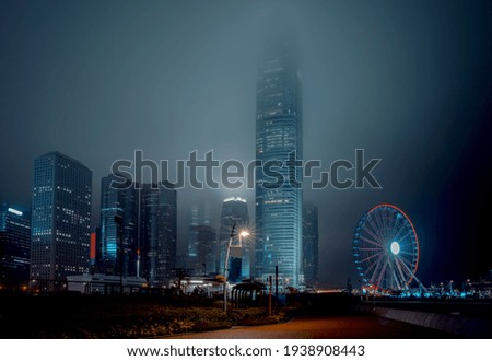 Modern office buildings in Hong Kong at foggy night 