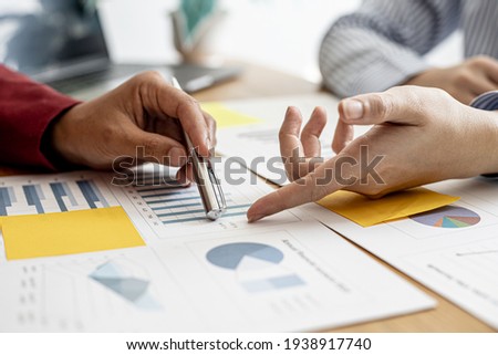 The sales department is having a monthly summary meeting to bring it to the department manager, they are verifying the correctness of the documents that are prepared before bringing in to the manager Royalty-Free Stock Photo #1938917740